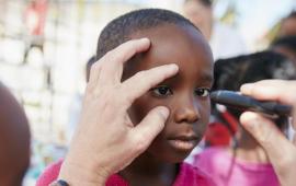 Young child receiving a mobile vision test