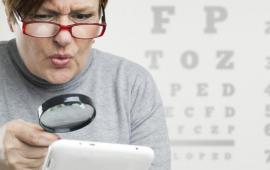 Woman reading with a magnifying glass