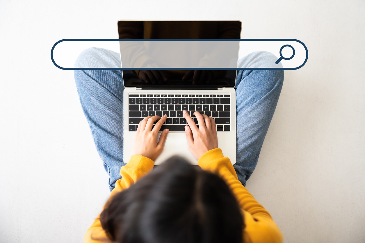 Woman searching on a laptop
