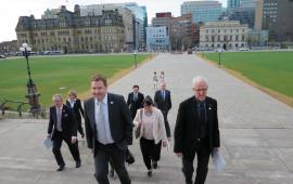 CAO Council walking uo the steps of parliament