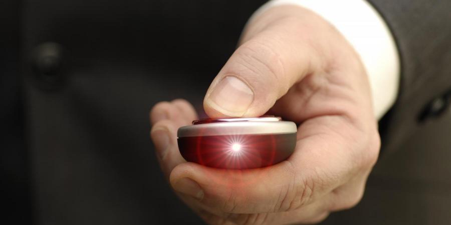 Hand holding a laser pointer