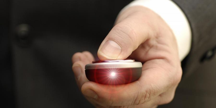 Hand holding a laser pointer