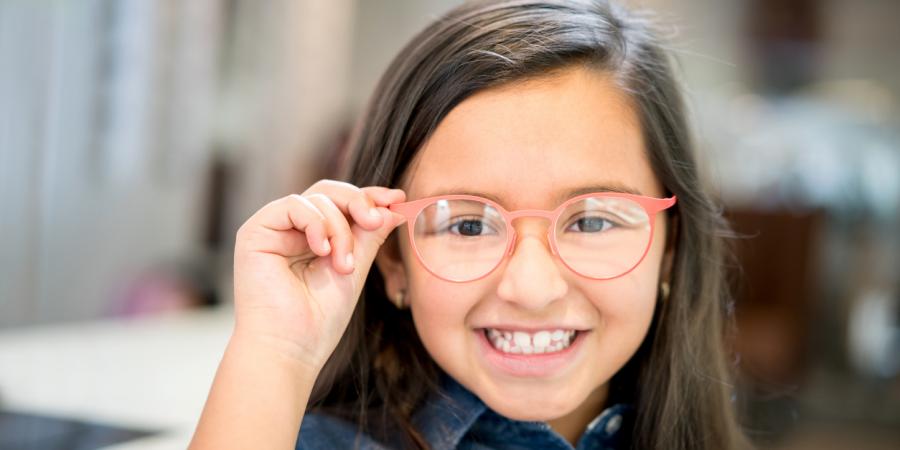 Smiling girl with new glasses